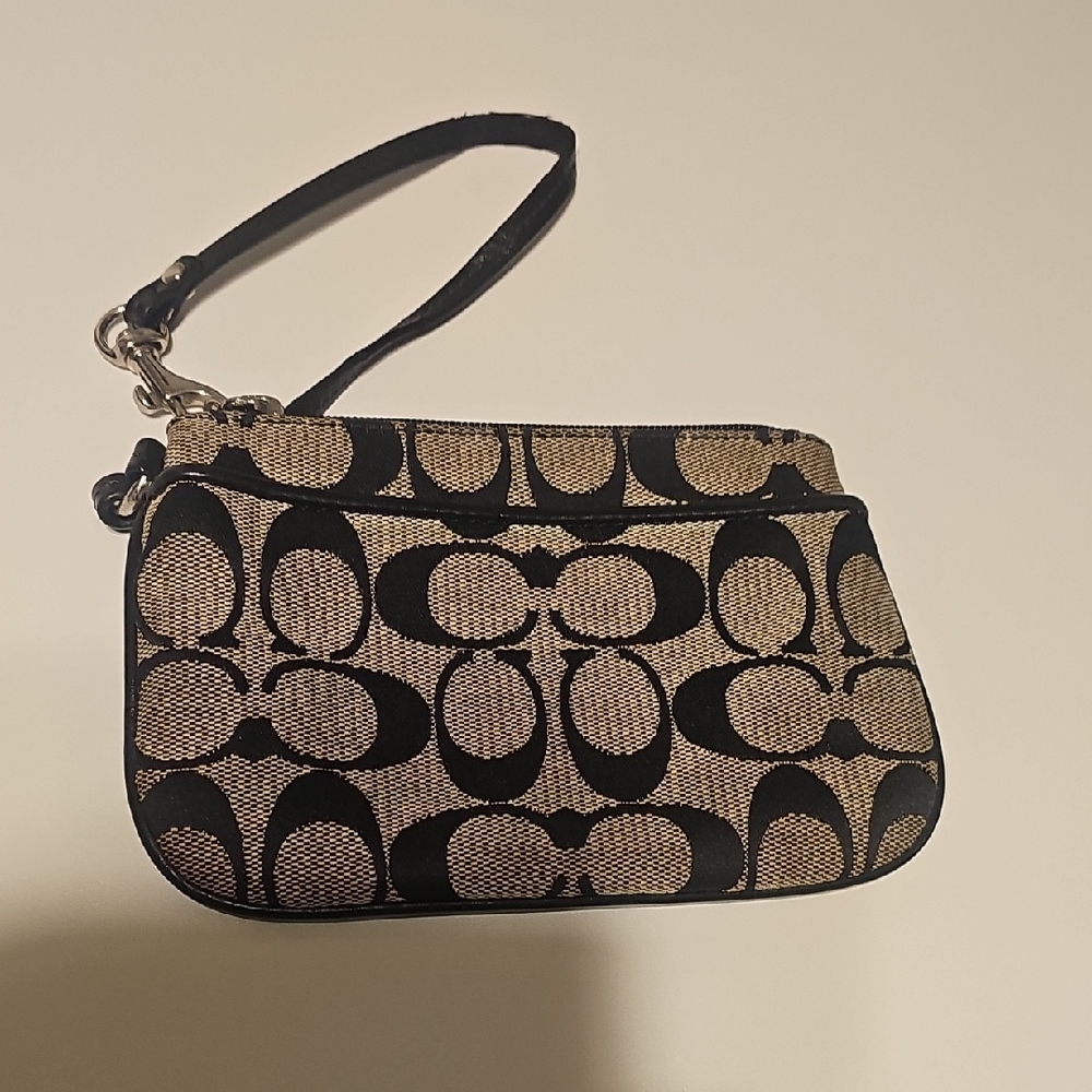 Coach Black and Cream Clutch with Circular Pattern